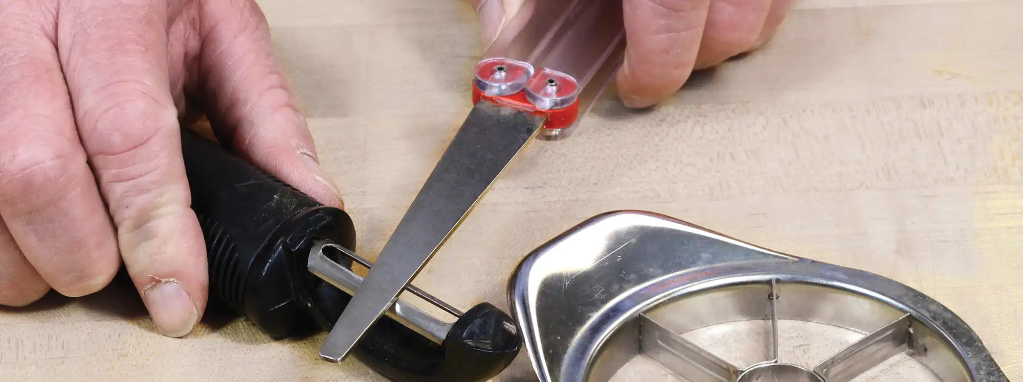 Bicycle wheel being repaired with a spoke wrench and file.